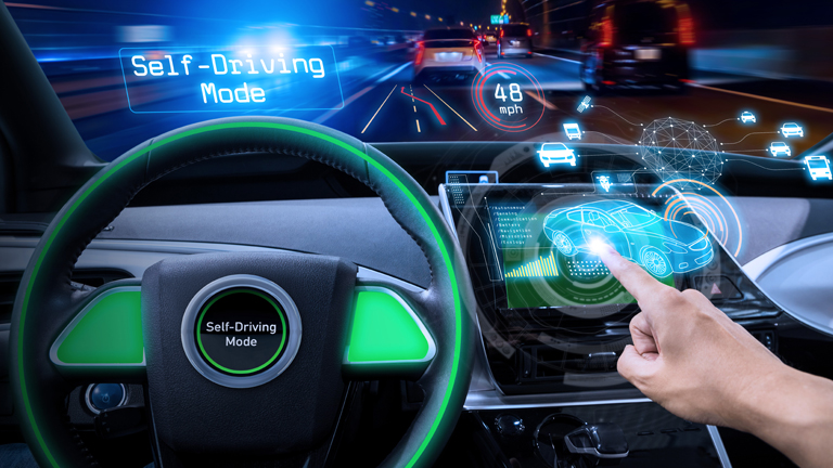 Person using the navigation system on the dahboard of their self driving car
