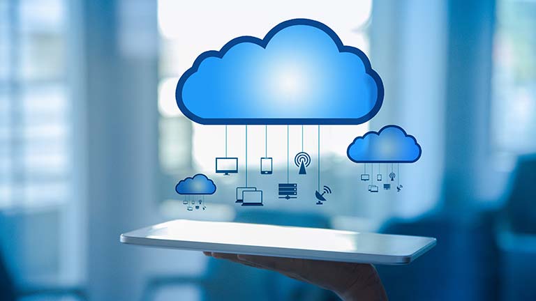 Graphic of cloud computing hovering over a tablet