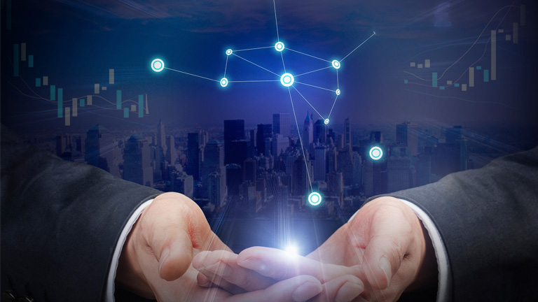 conceptual image of hands holding a city and IoT connectors overlay