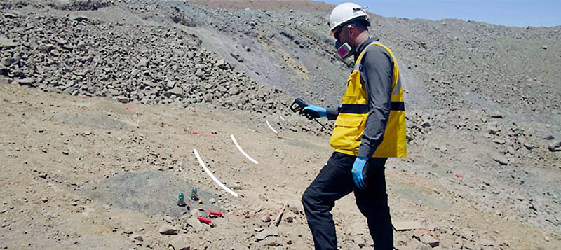 Employee using remote control electronic detonator in a mine Employee using remote control electronic detonator in a mine