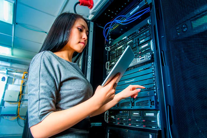 woman in computer datacenter woman in computer datacenter