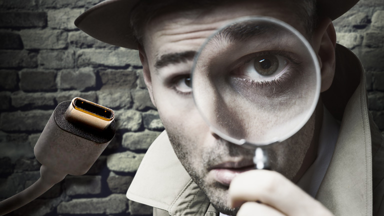 Front view of a man looking through a magnifying glass