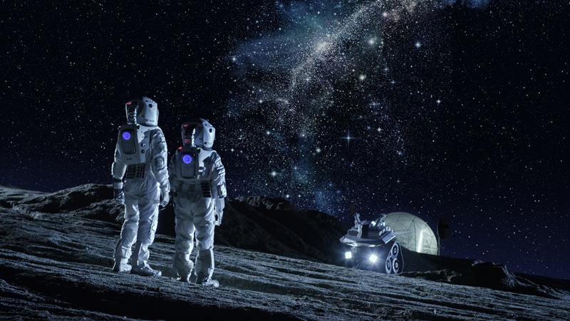 Two astronauts observing Milky Way